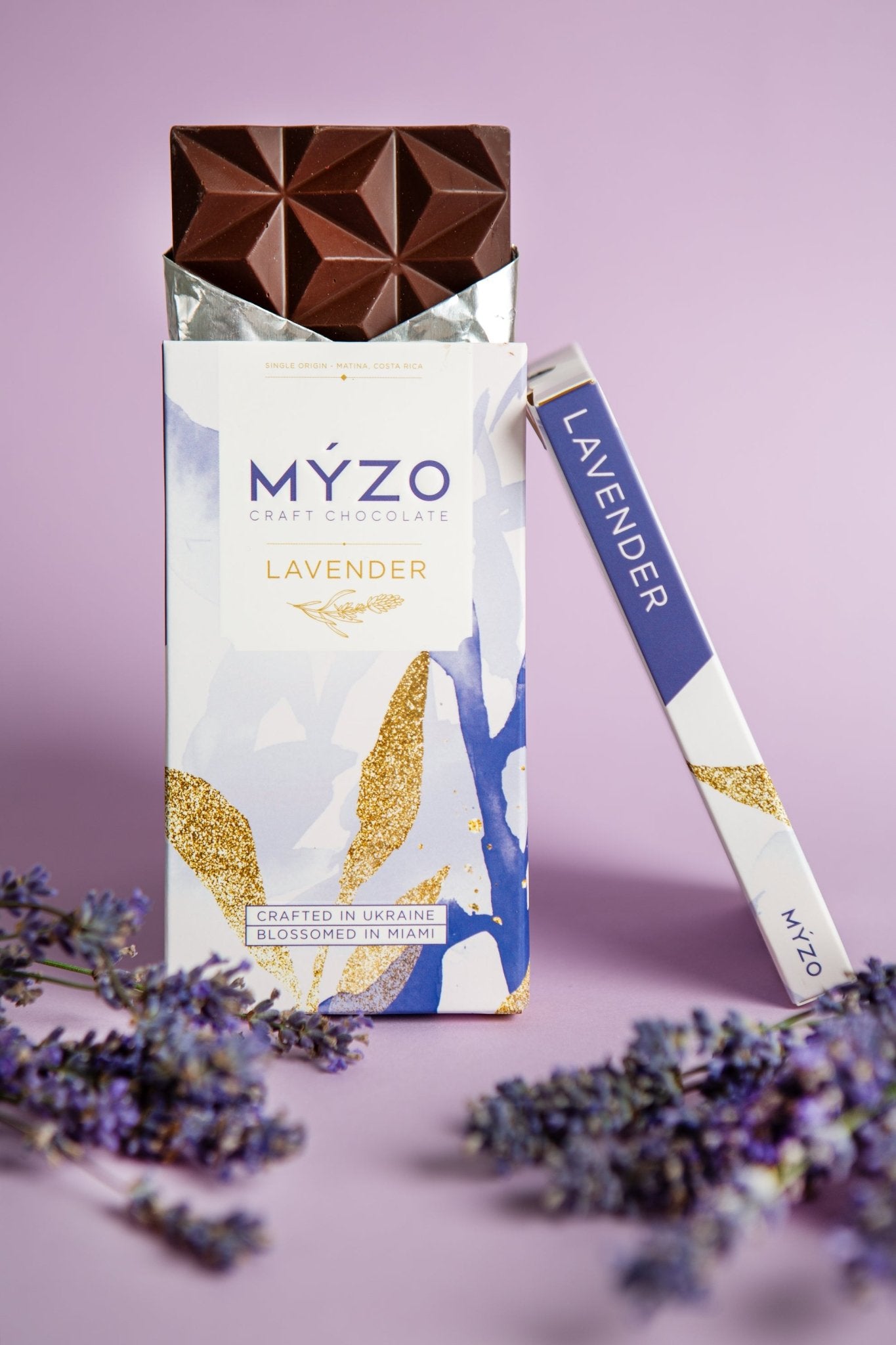 MYZO Lavender Dark Chocolate styled with sprigs of fresh lavender on a neutral background