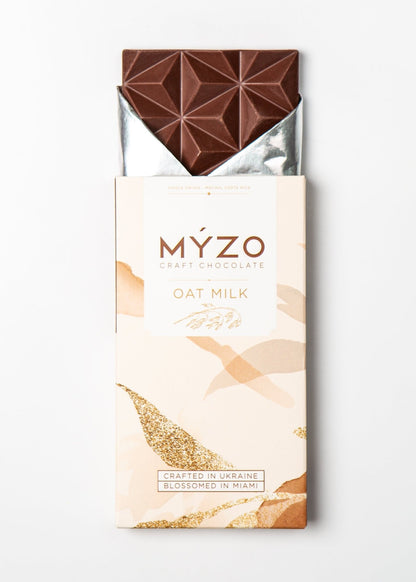 MYZO 48% Oat Milk Chocolate bar unwrapped — creamy vegan single-origin chocolate